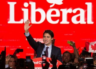 Justin Trudeau waving hand during in his speech at election campaign